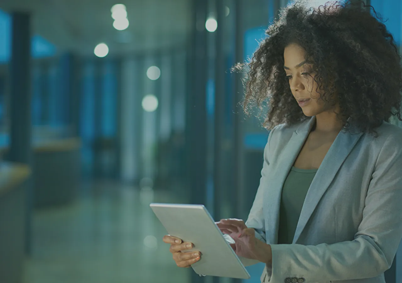A recruiter reviewing data on a tablet